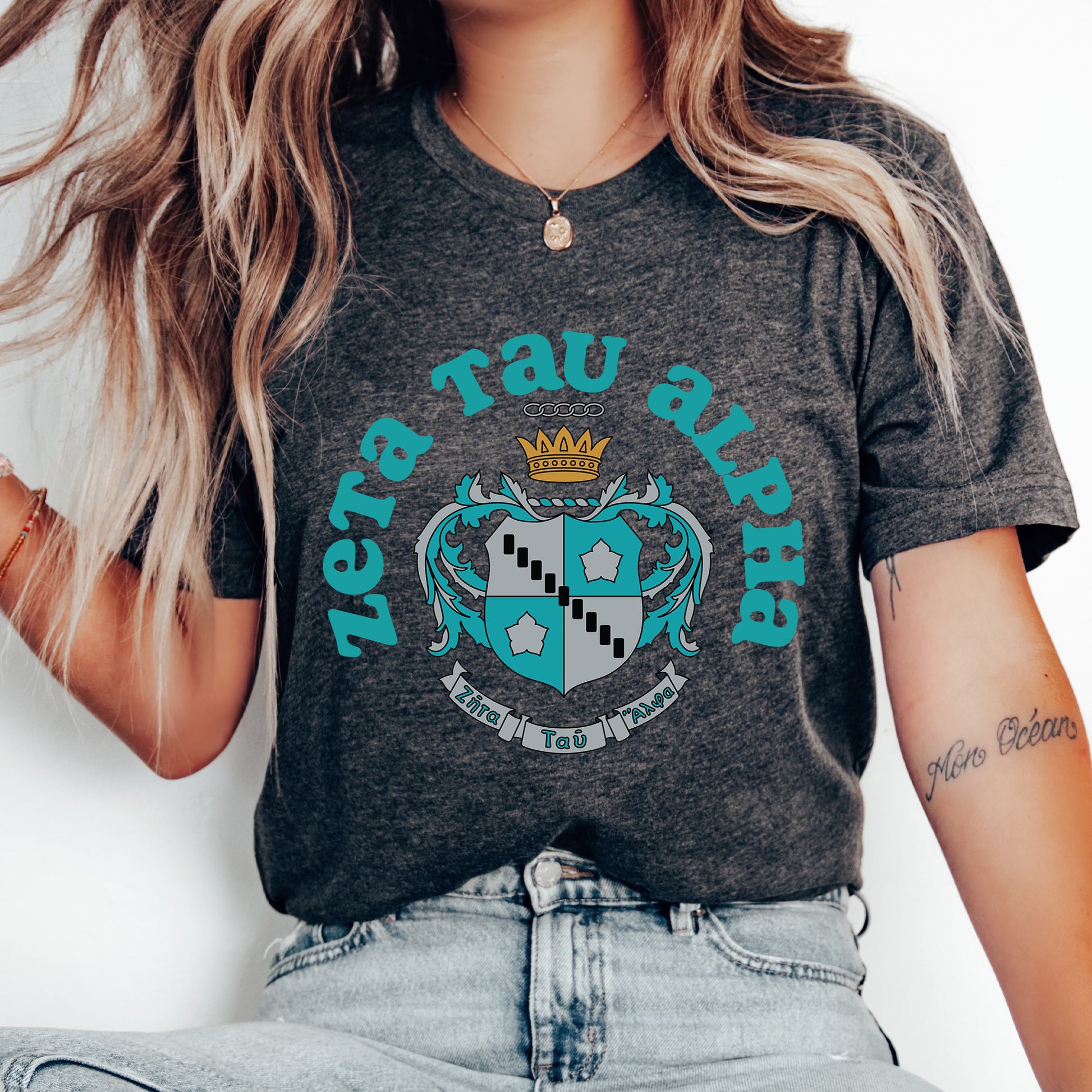 a woman wearing a t - shirt with a crown on it