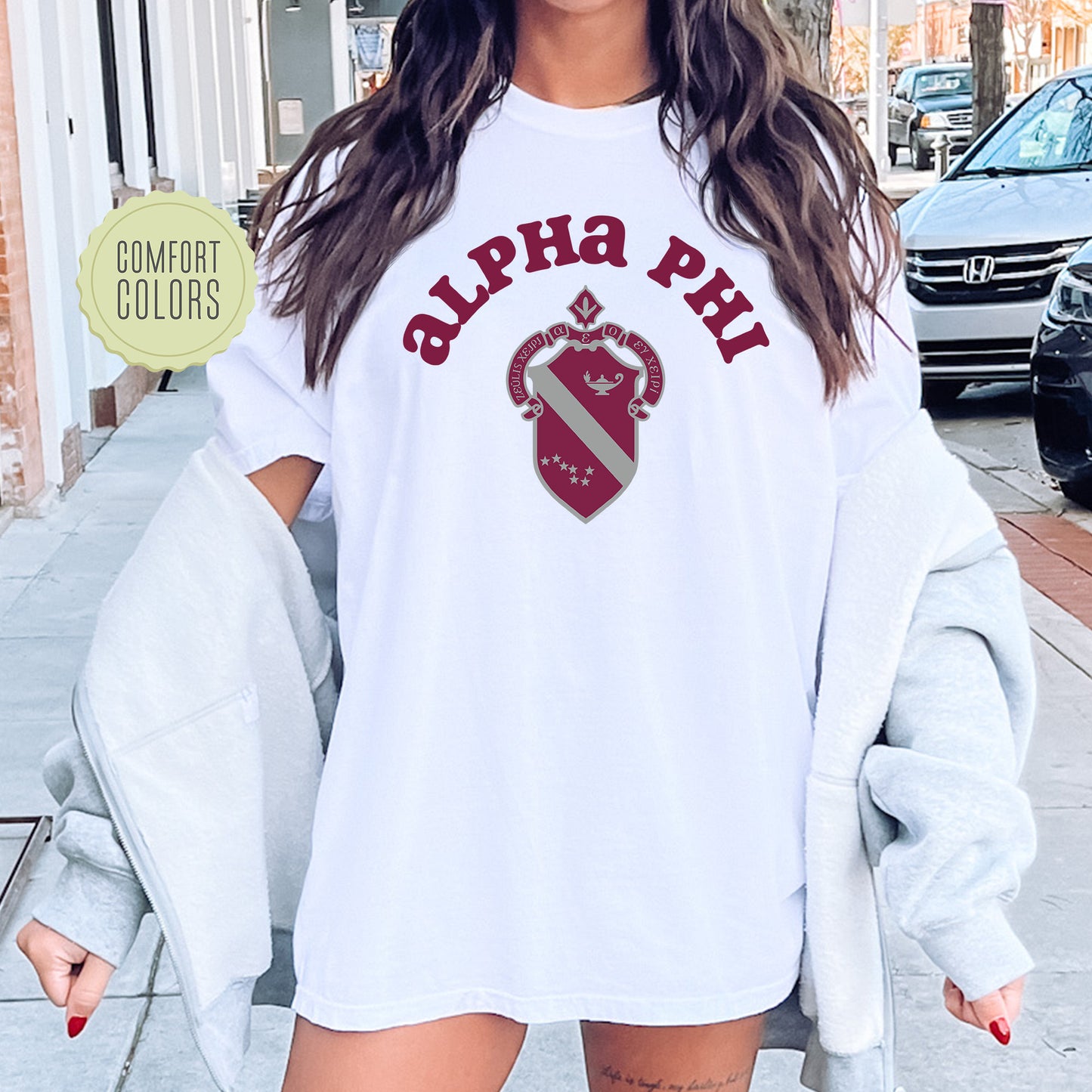 a woman wearing a white shirt and shorts