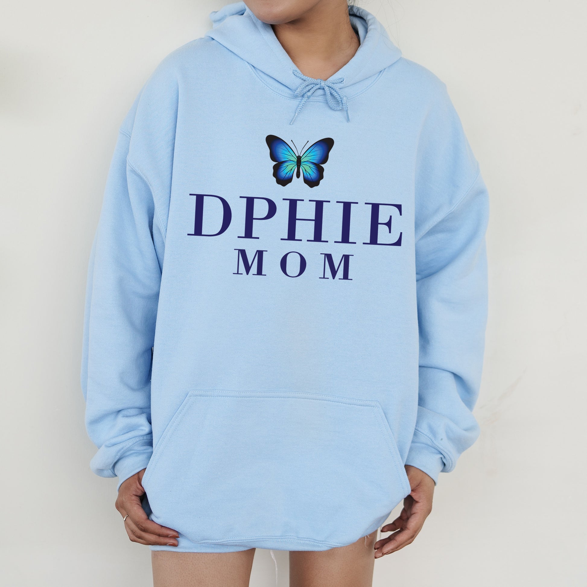 a woman wearing a blue hoodie with a butterfly on it