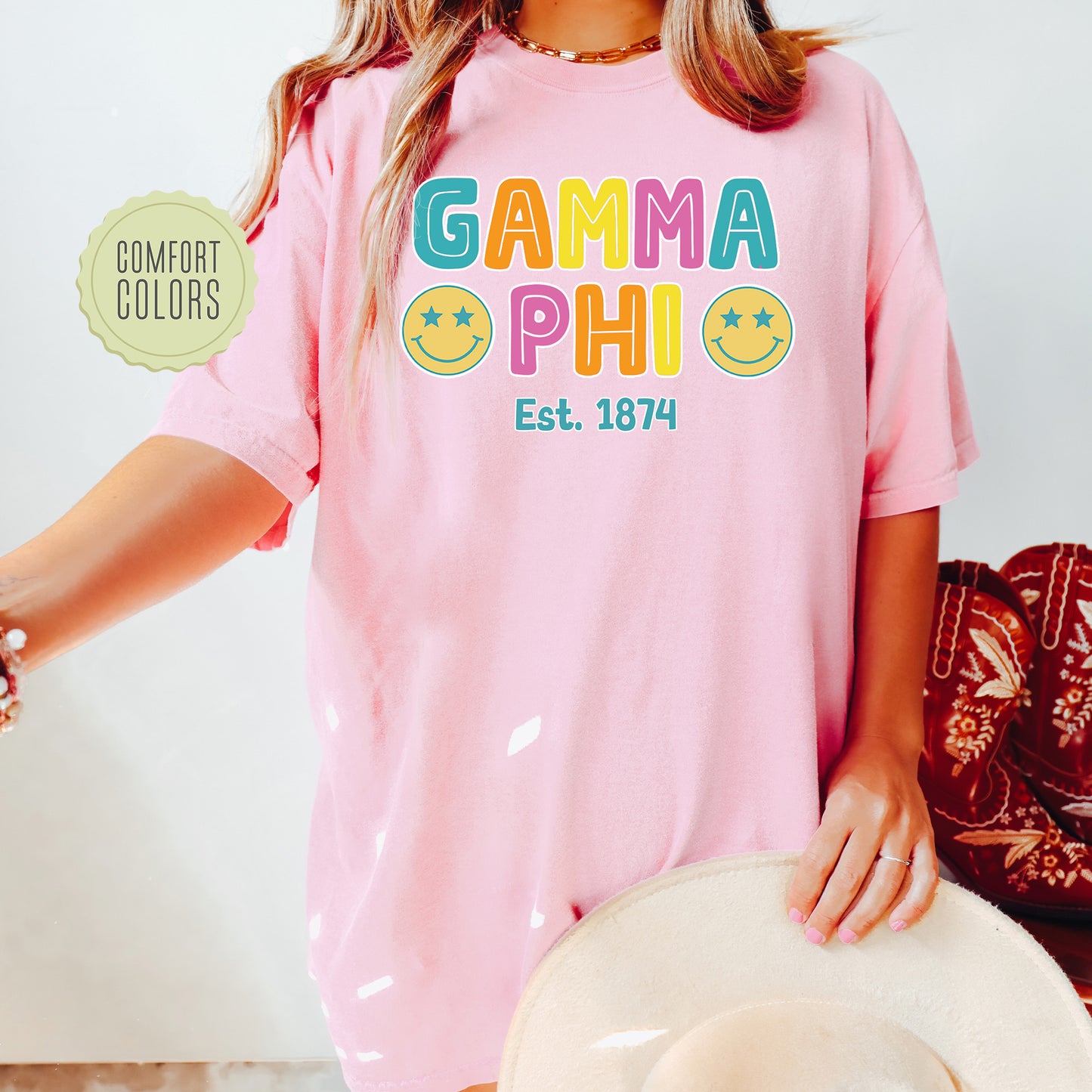 a woman wearing a pink shirt and hat