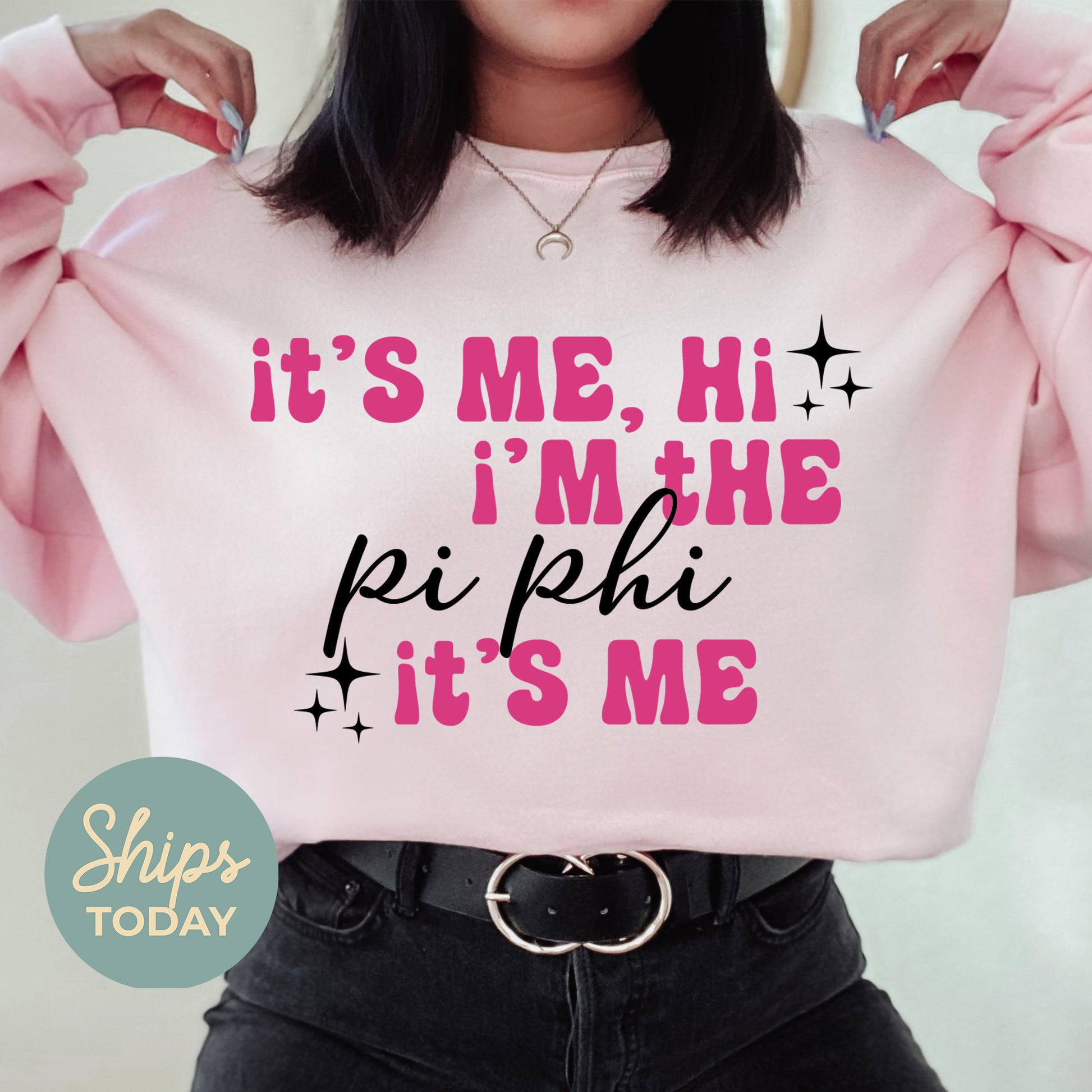 a woman wearing a pink sweatshirt that says it's me, i'm