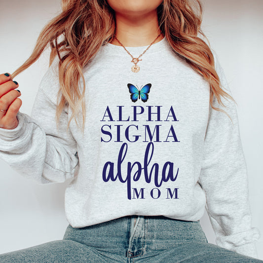 a woman wearing a sweatshirt with a butterfly on it