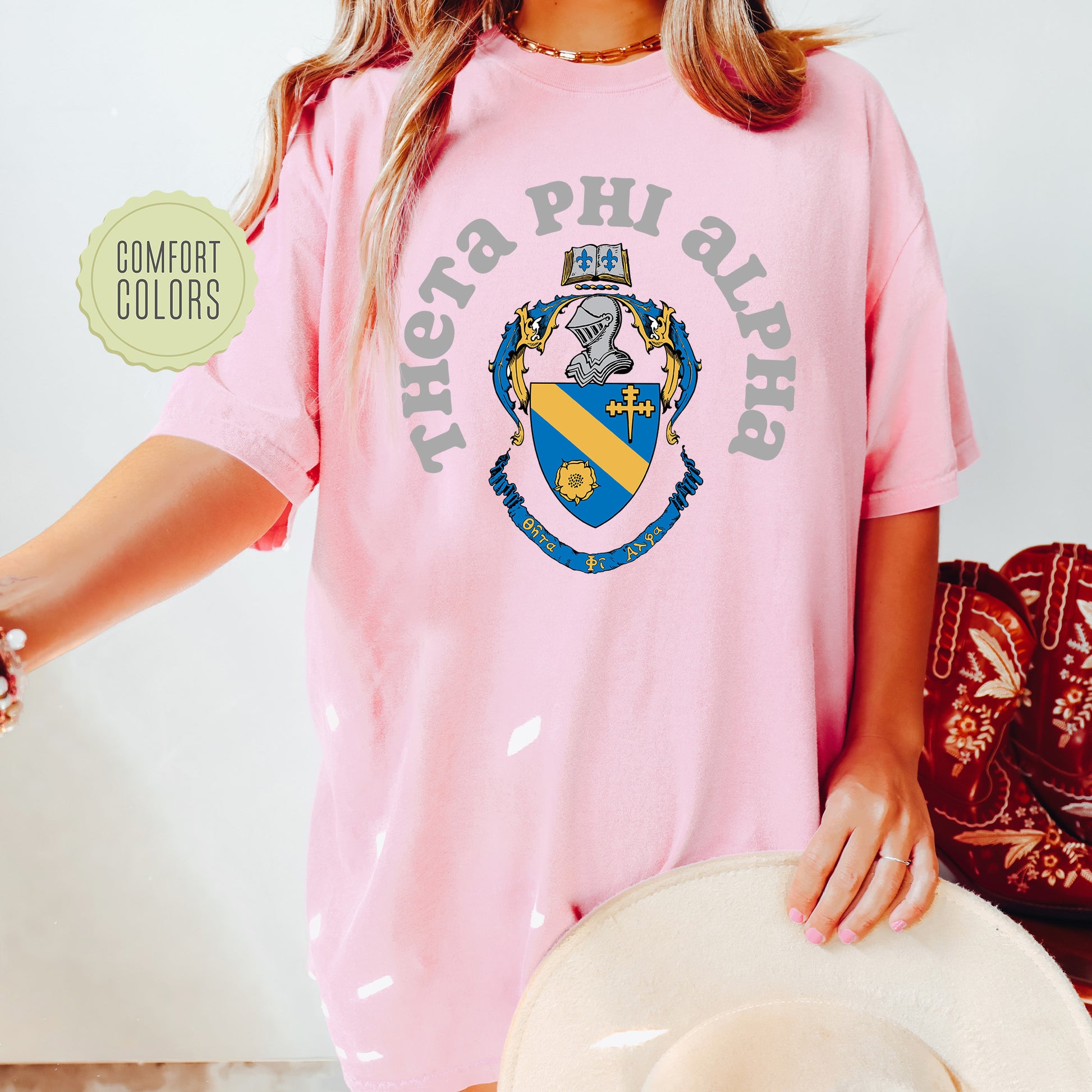 a woman wearing a pink shirt and hat