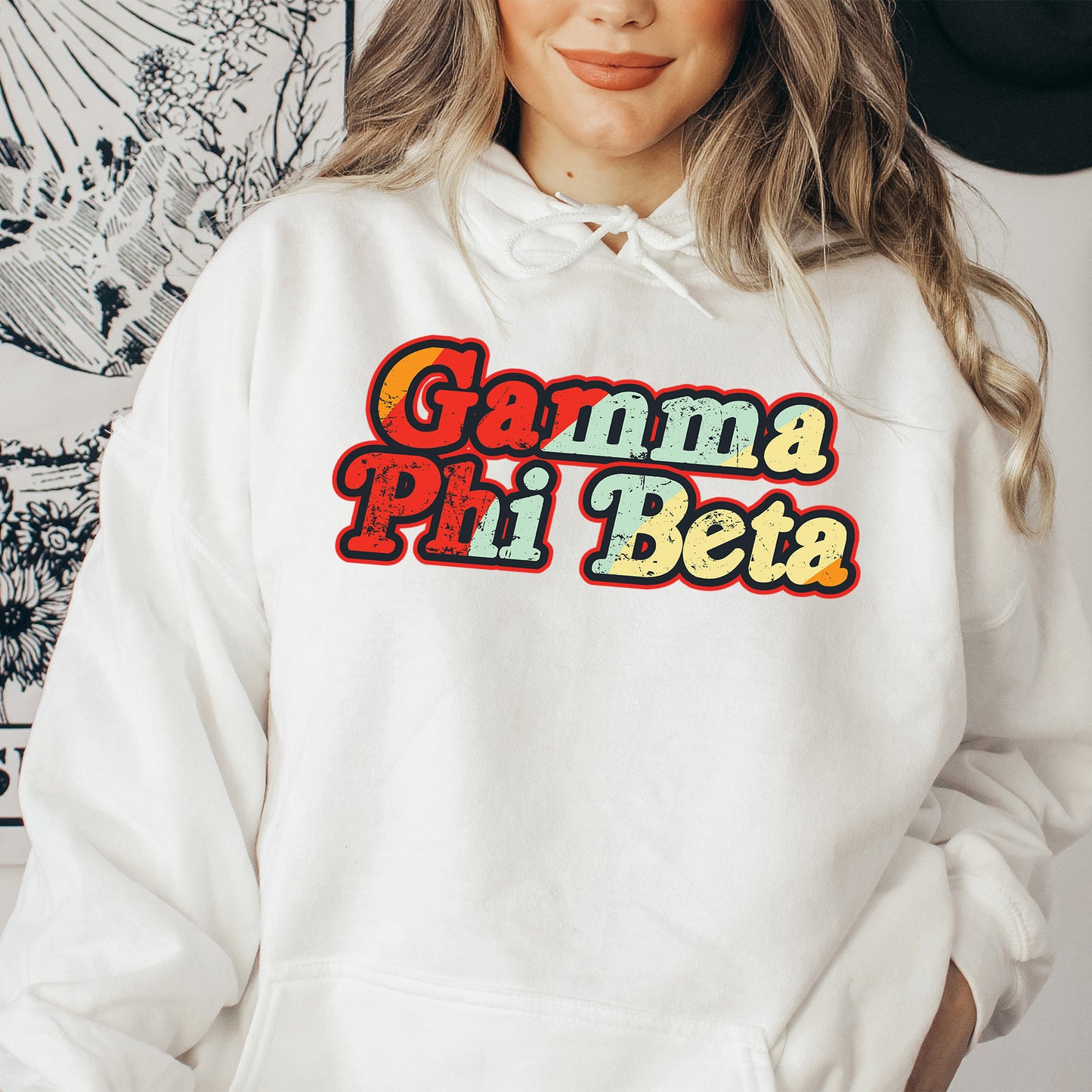 a woman wearing a white hoodie that says garma pi piea