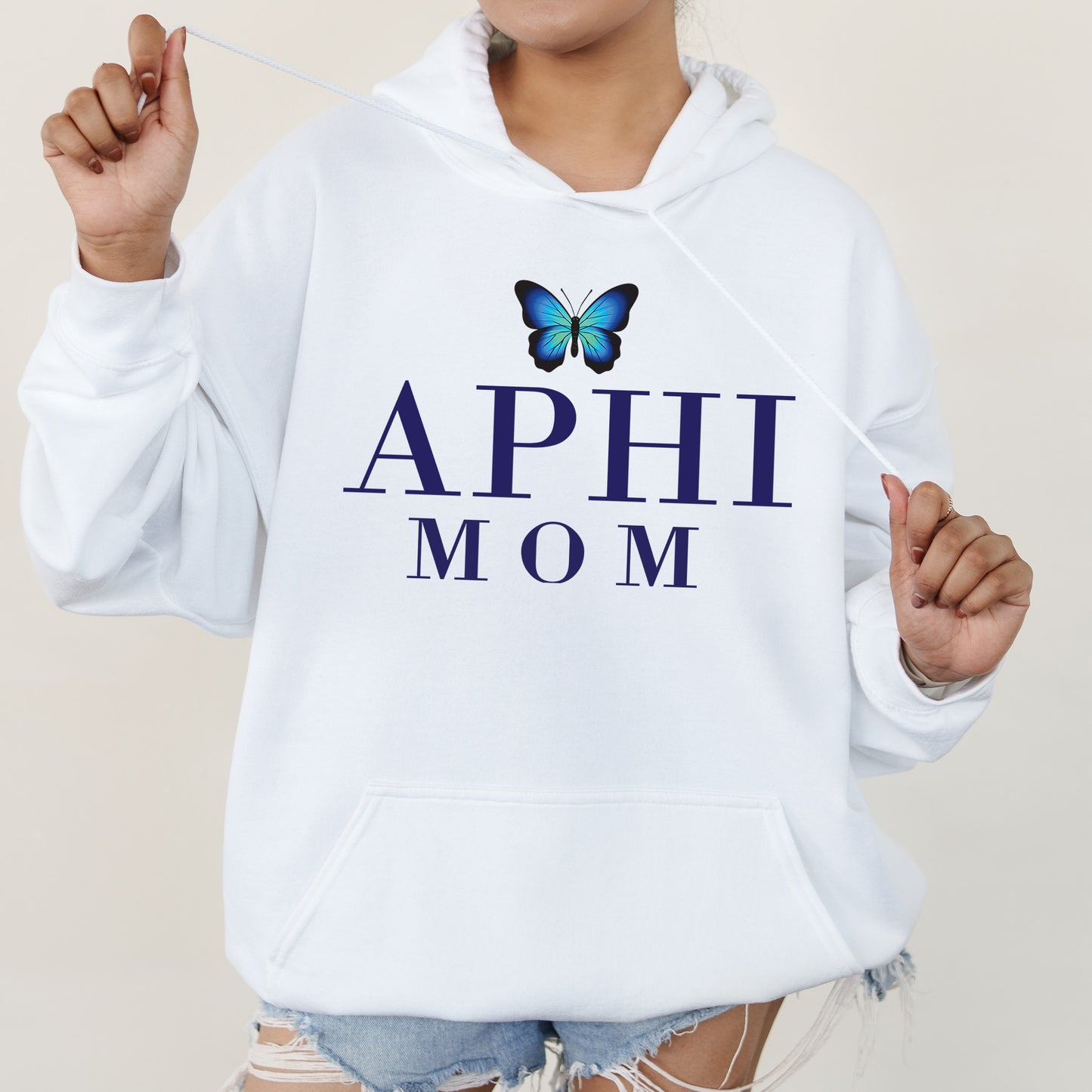 a woman wearing a white hoodie with a butterfly on it