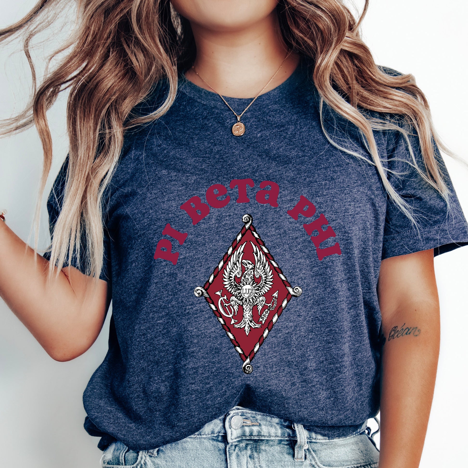a woman wearing a blue shirt with a dragon on it