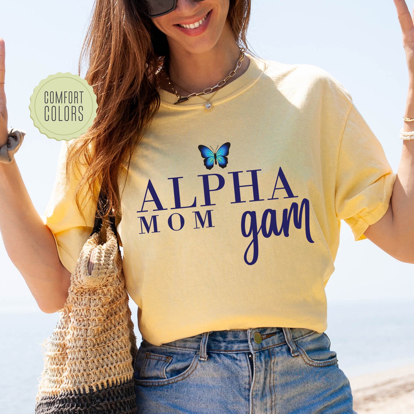 a woman in a yellow shirt is holding up a peace sign