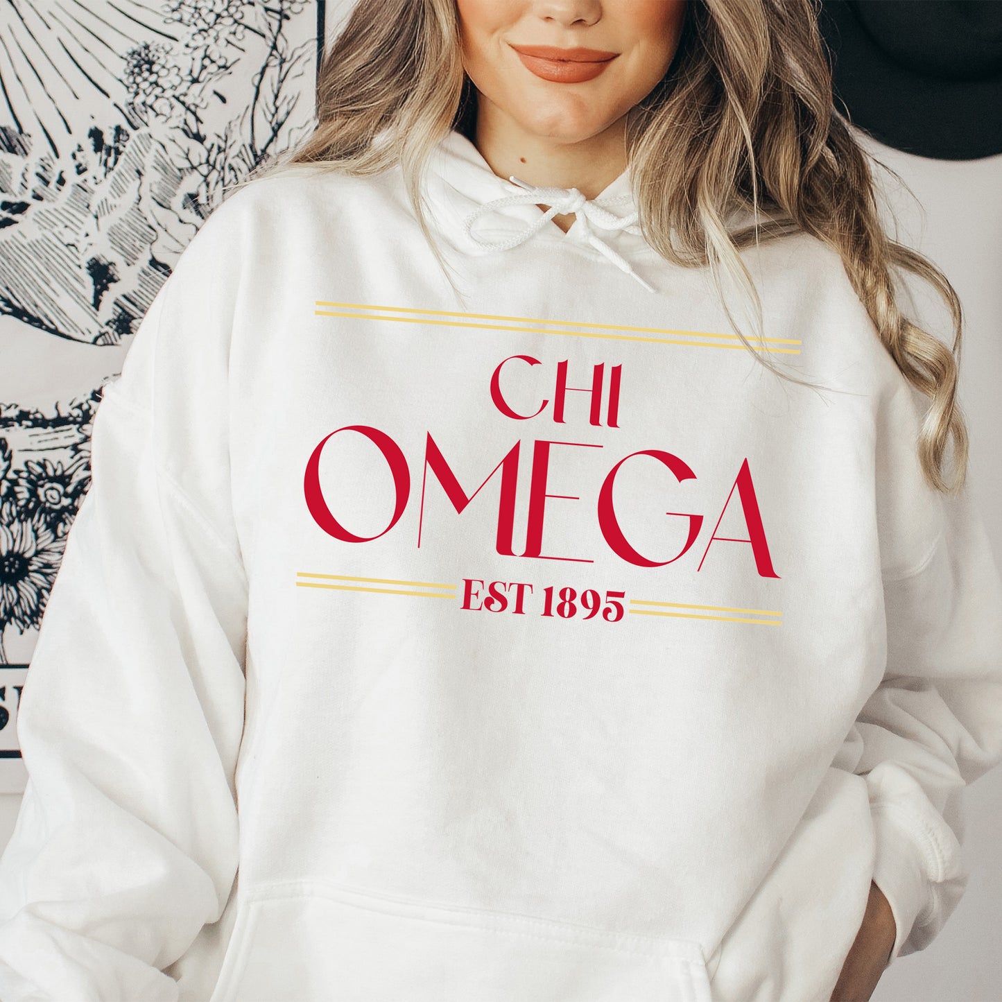a woman wearing a white hoodie with a red omega on it