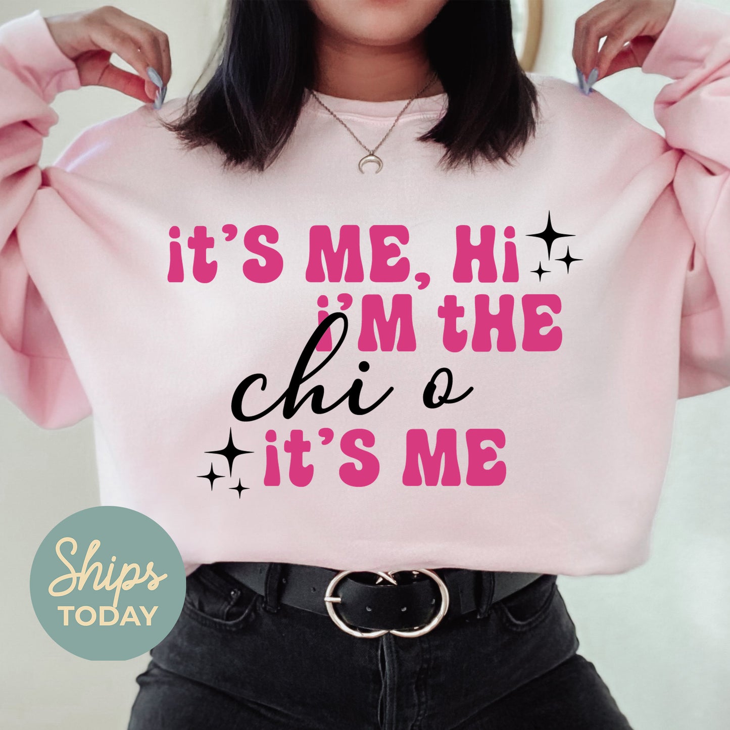 a woman wearing a pink sweatshirt that says it's me, i'm