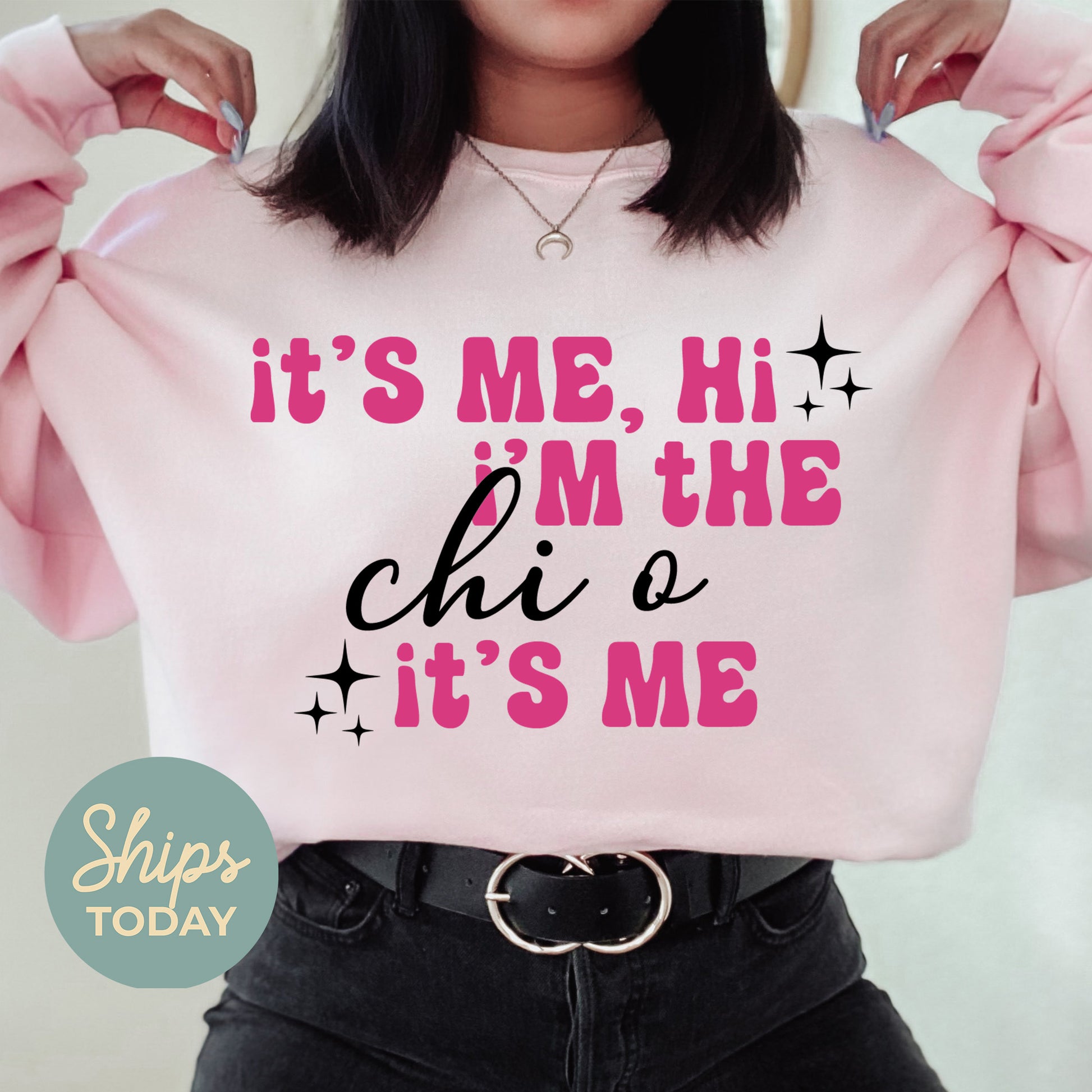 a woman wearing a pink sweatshirt that says it's me, i'm