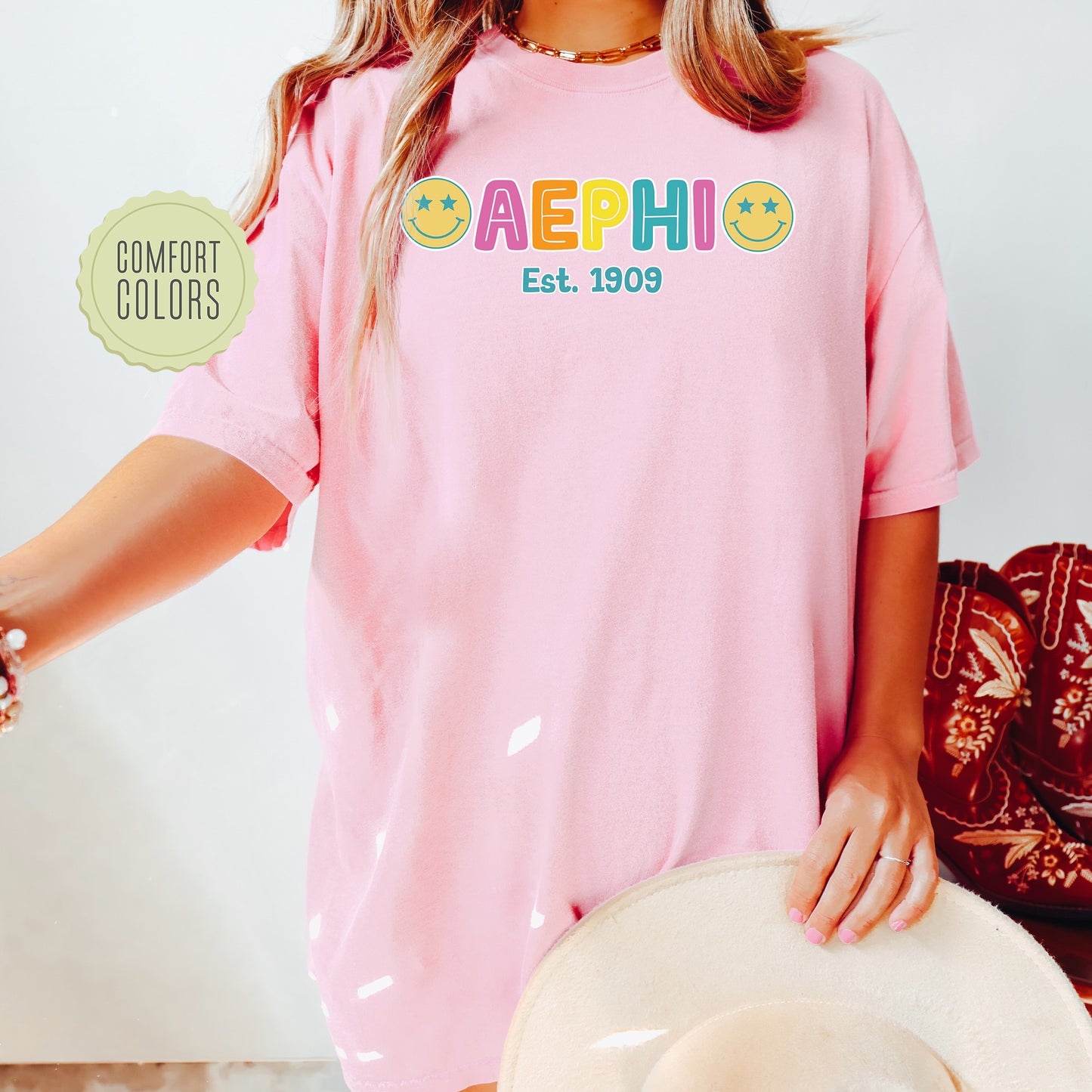 a woman wearing a pink shirt and hat