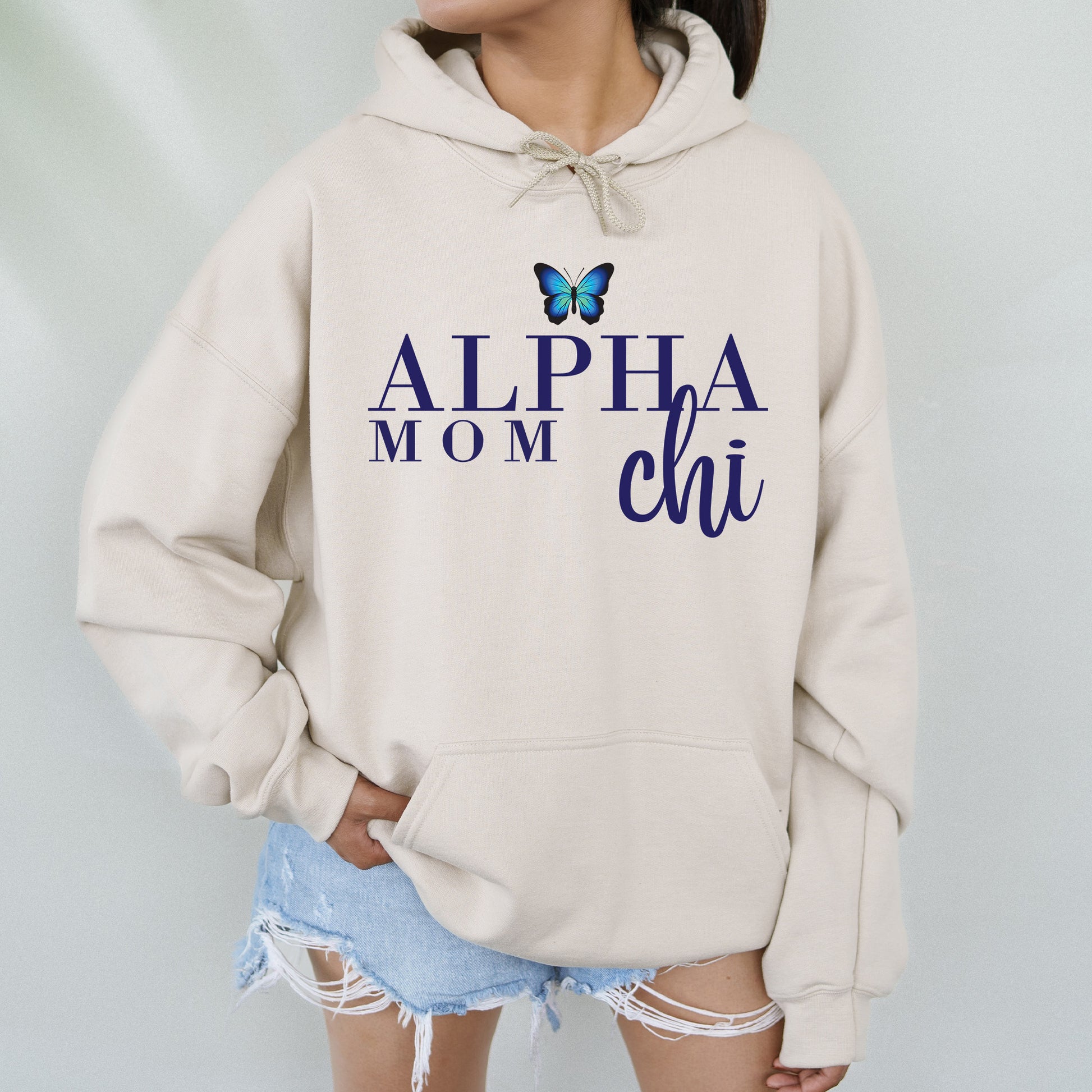 a woman wearing a sweatshirt with a butterfly on it