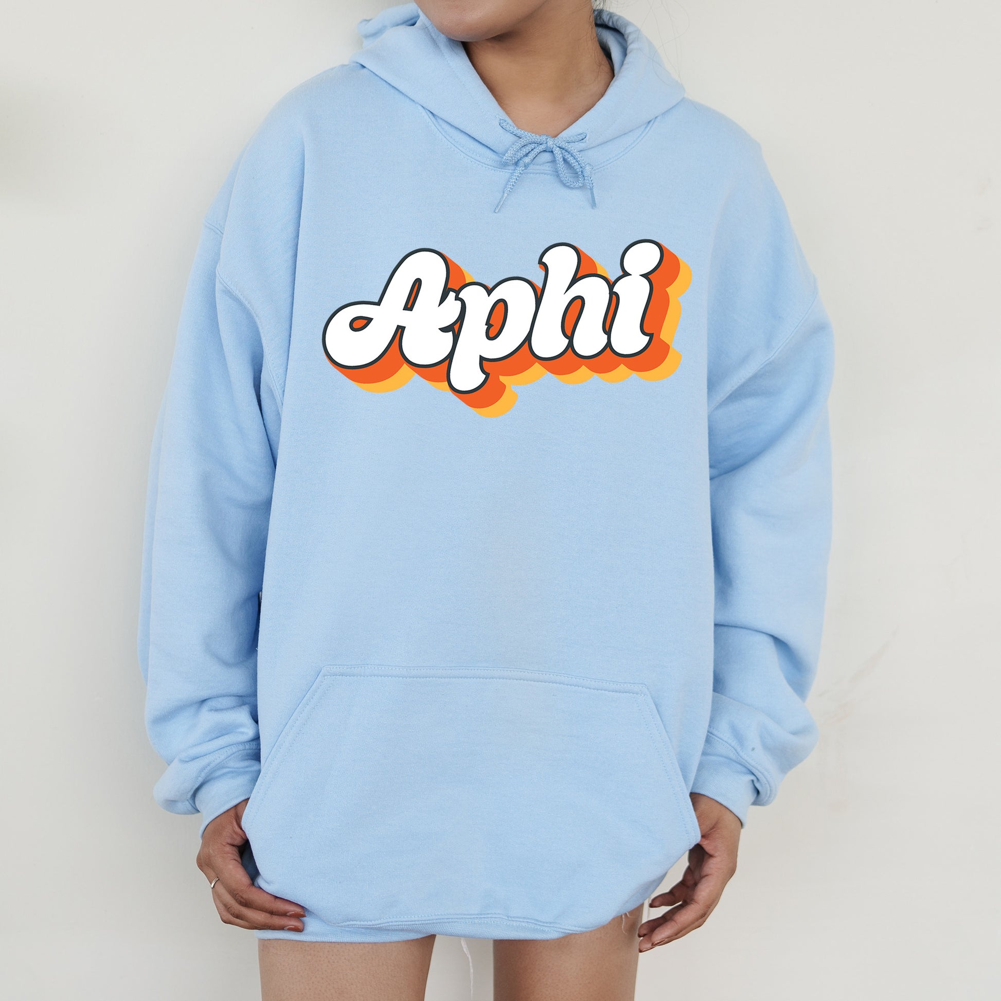 a person wearing a blue hoodie with the word appli on it