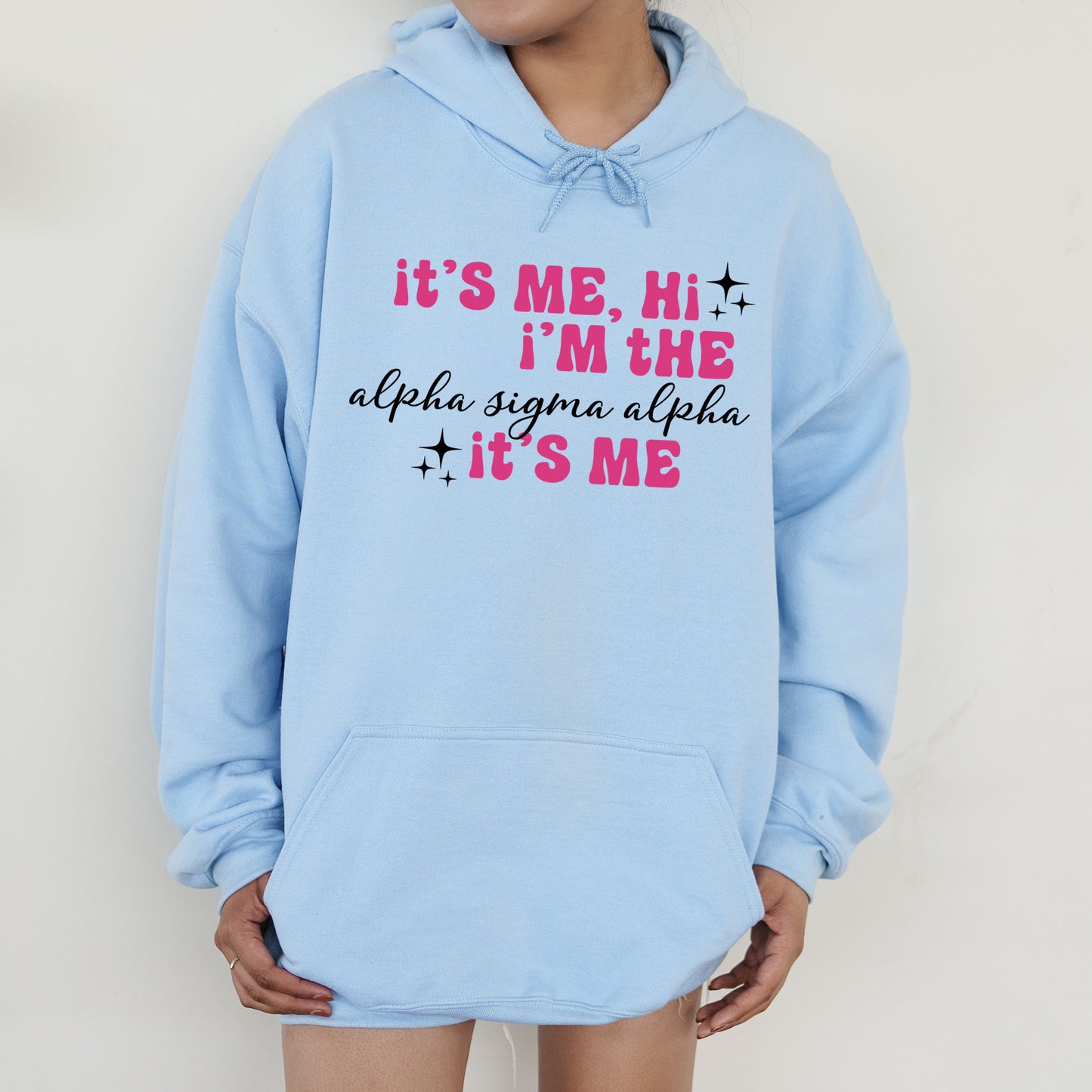 a person wearing a blue hoodie that says it's me, i '