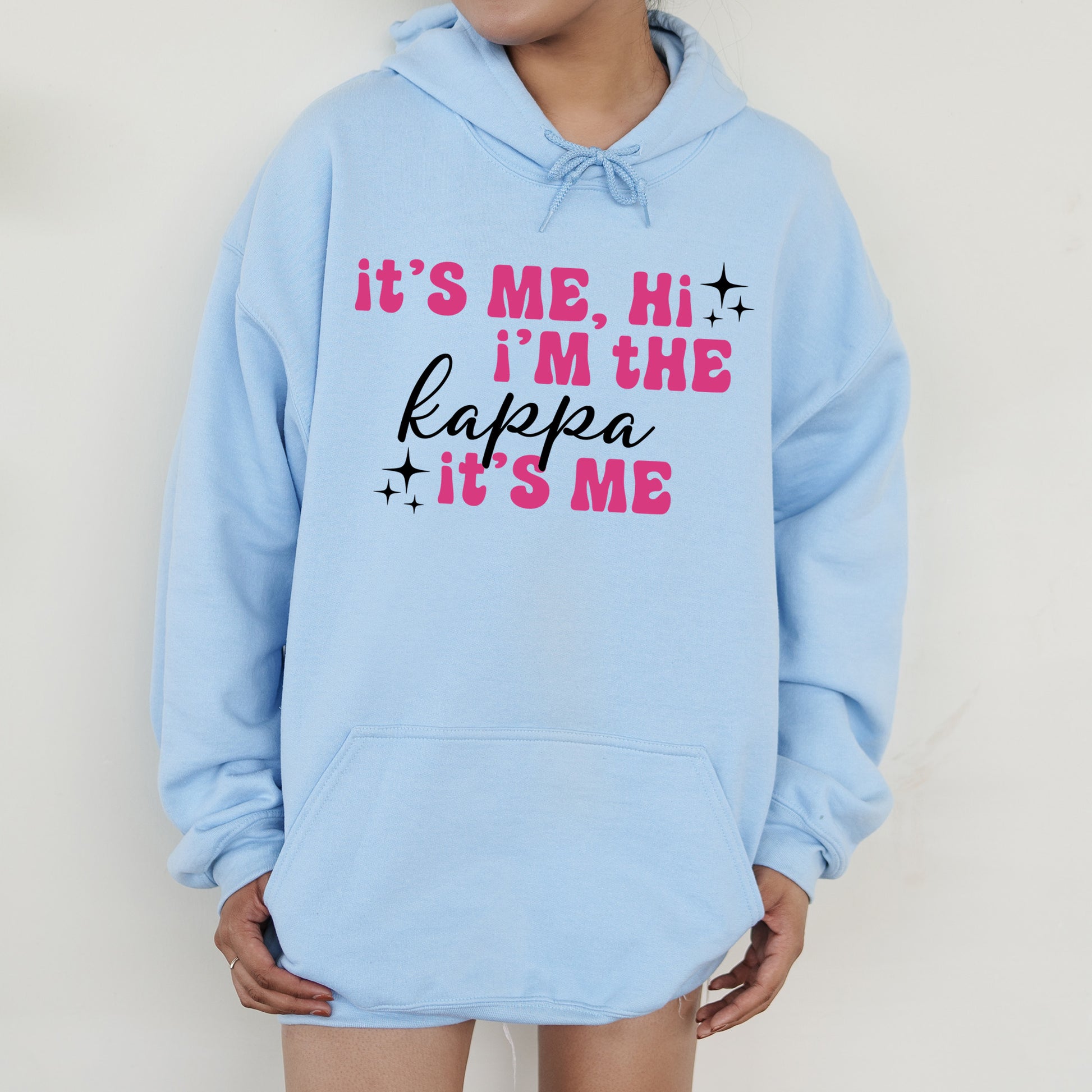 a person wearing a blue hoodie that says it's me, i '