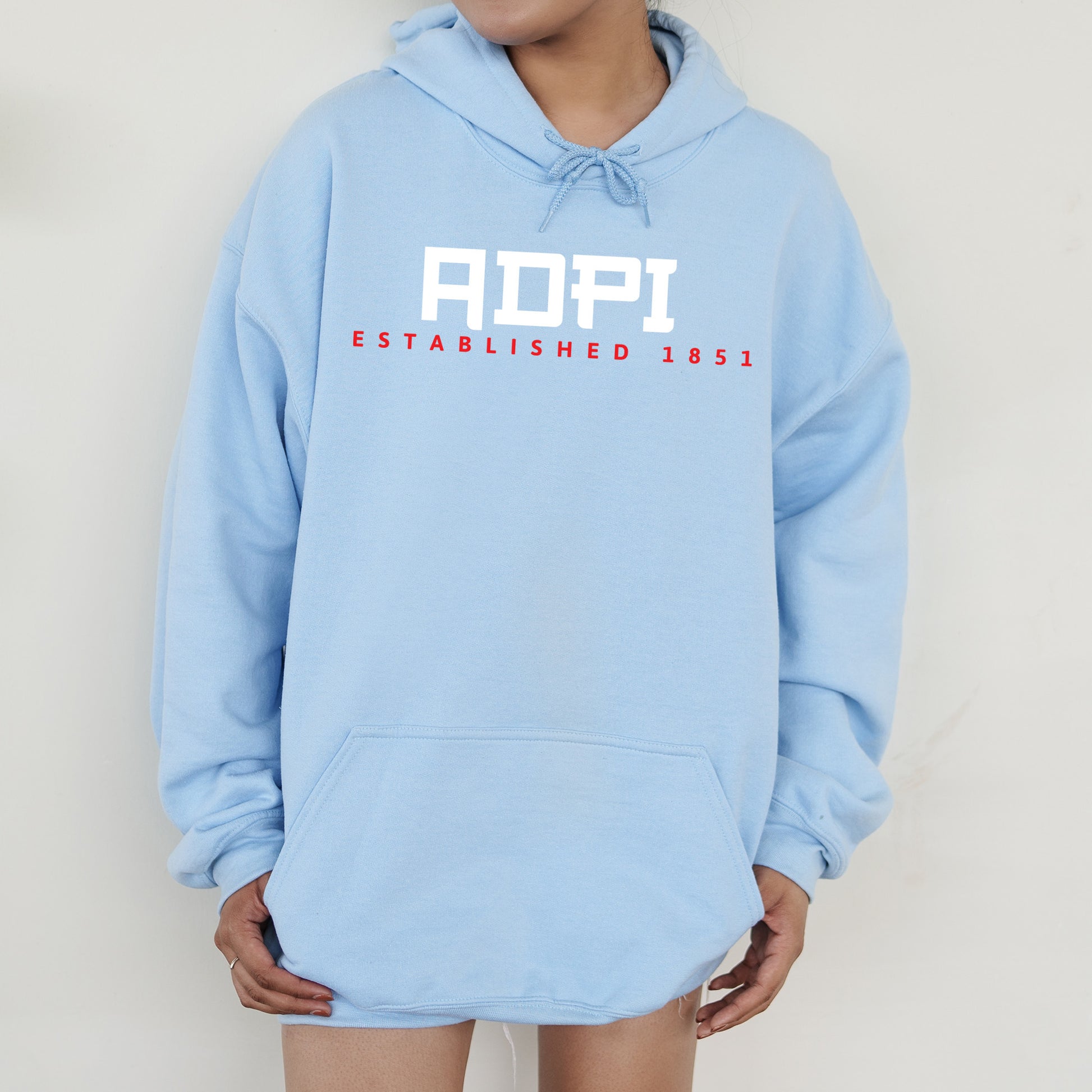 a person wearing a blue hoodie with the word aop on it