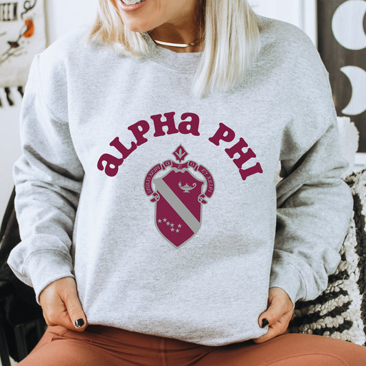 a woman sitting on a chair wearing a sweatshirt