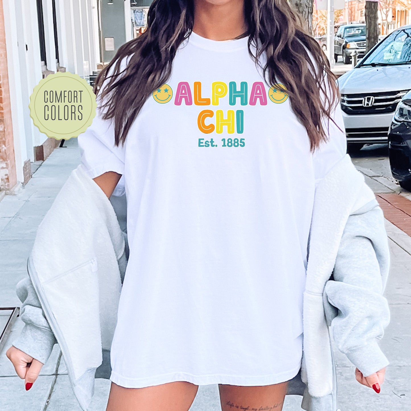a woman wearing a white shirt and shorts