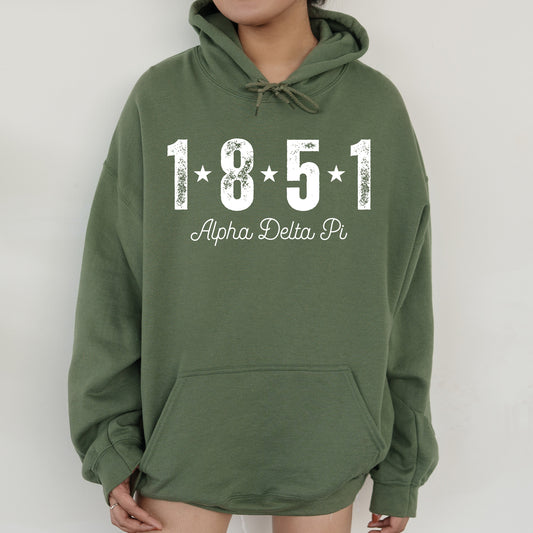 a woman wearing a green sweatshirt with a white number on it