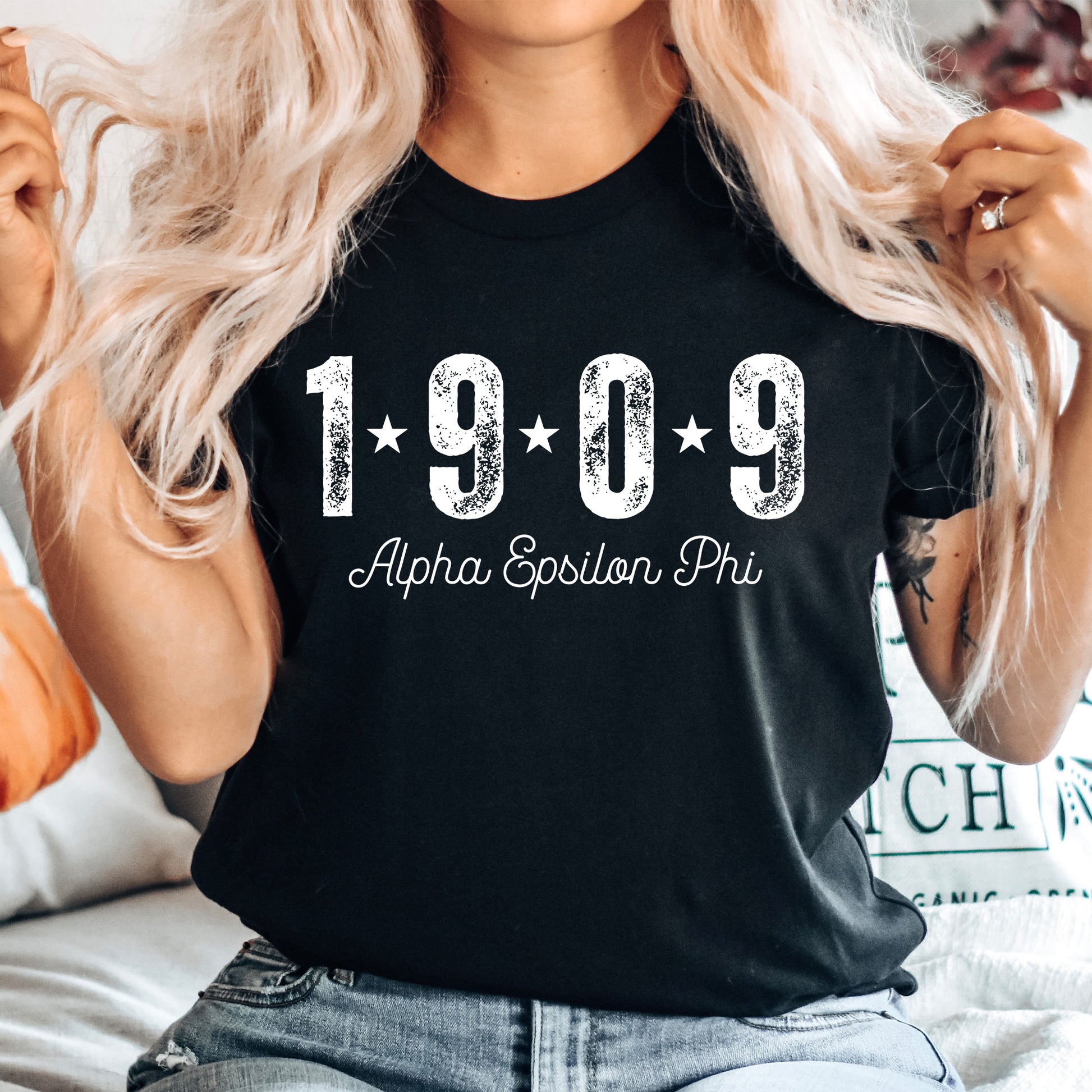 a woman wearing a black shirt with the year 1909 printed on it
