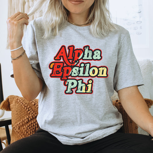 a woman sitting on a chair wearing a grey shirt