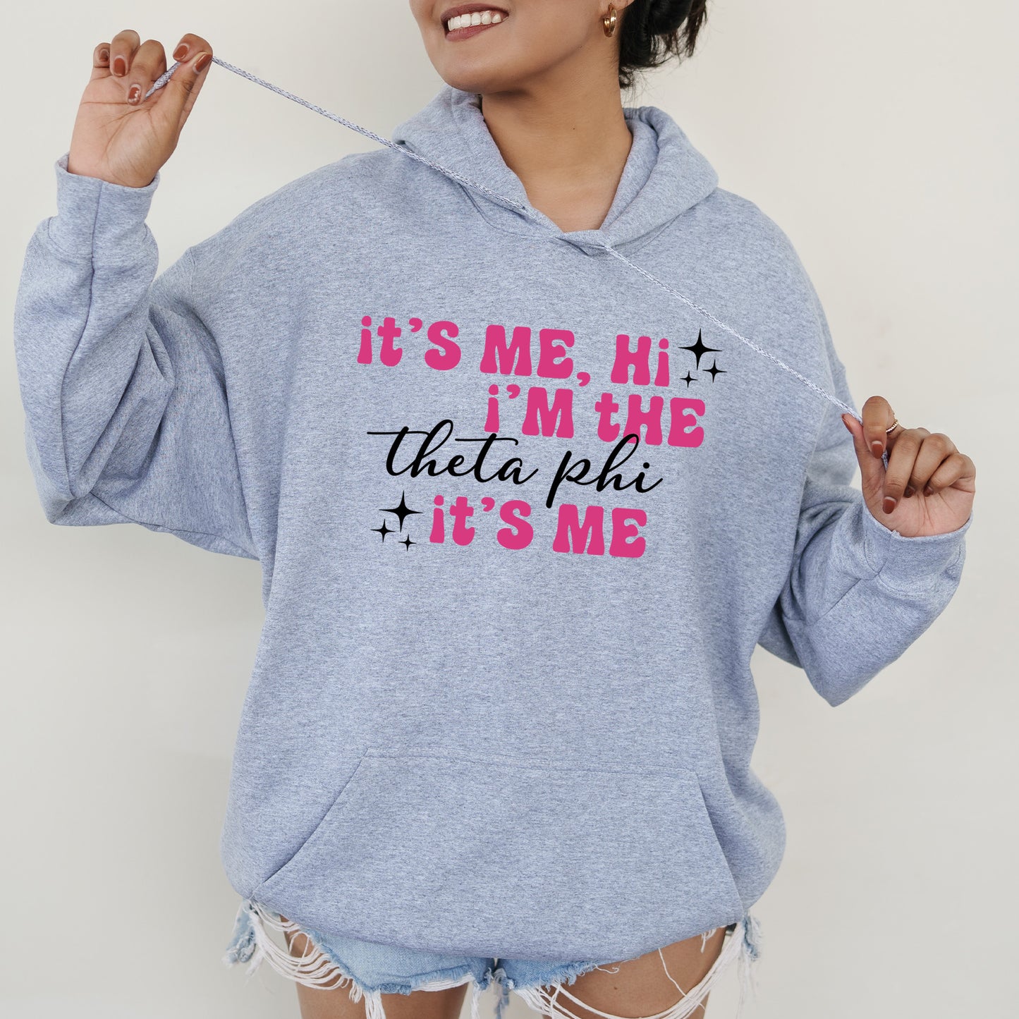 a woman wearing a blue hoodie that says it's me, i '