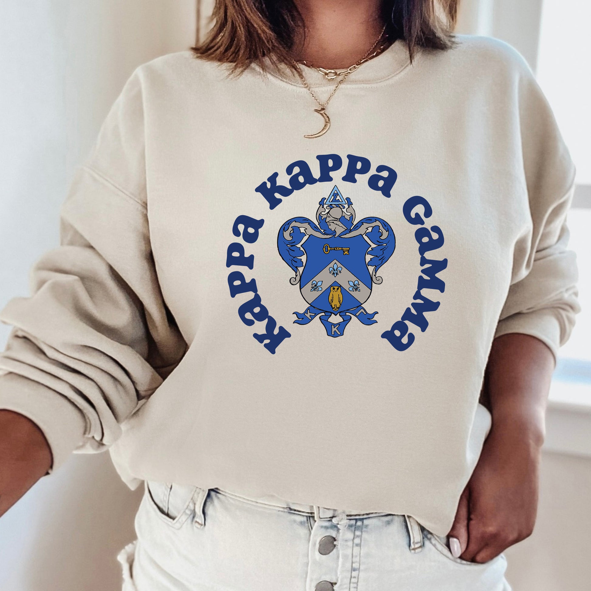 a woman wearing a sweatshirt that says happy kappa gravy
