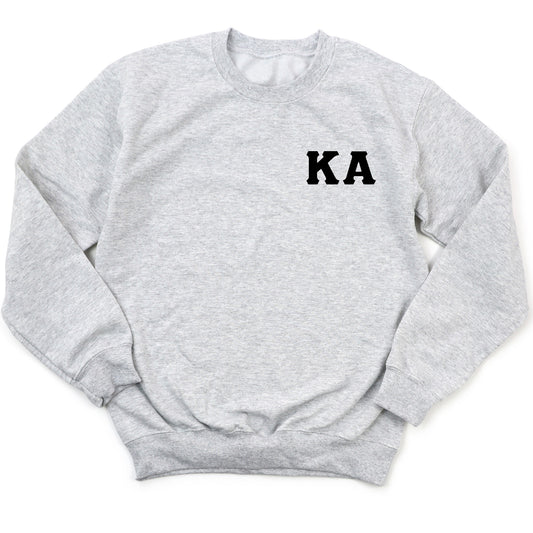 a grey sweatshirt with the word ka on it