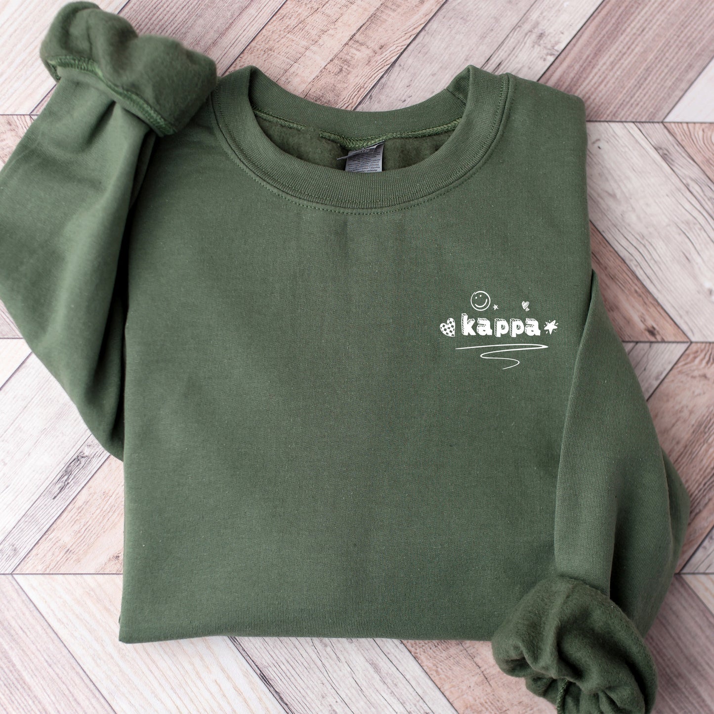 a green sweatshirt with the words kapaa on it