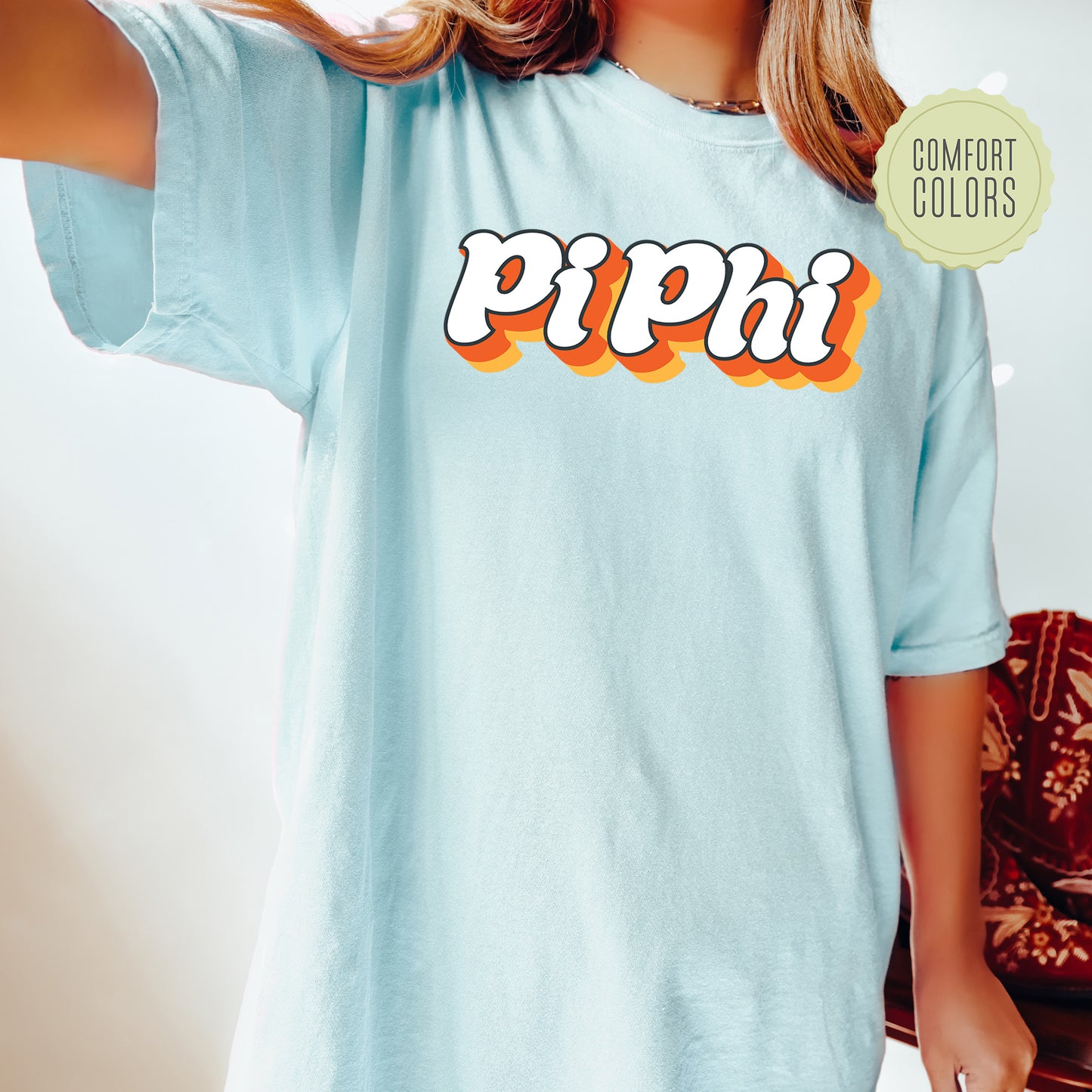 a woman wearing a blue shirt with the word pippi on it