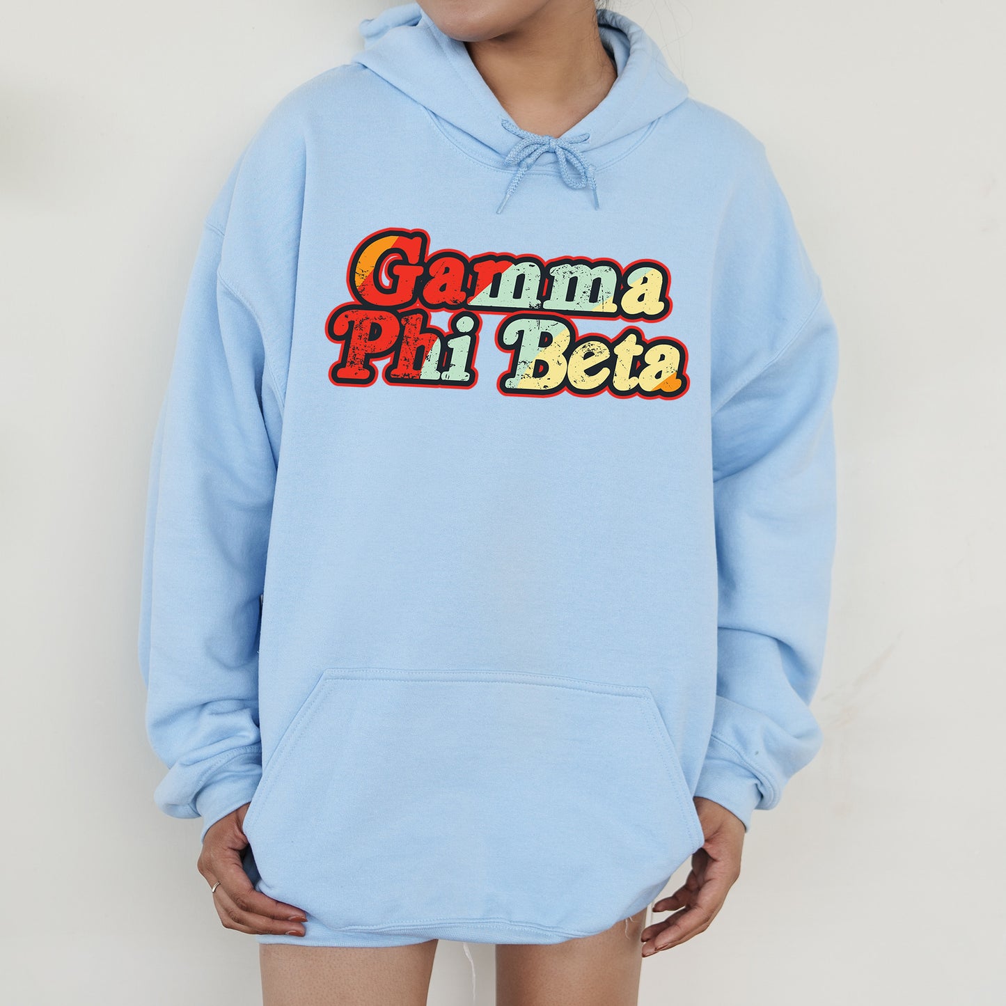 a person wearing a blue hoodie with the word game pii beta on