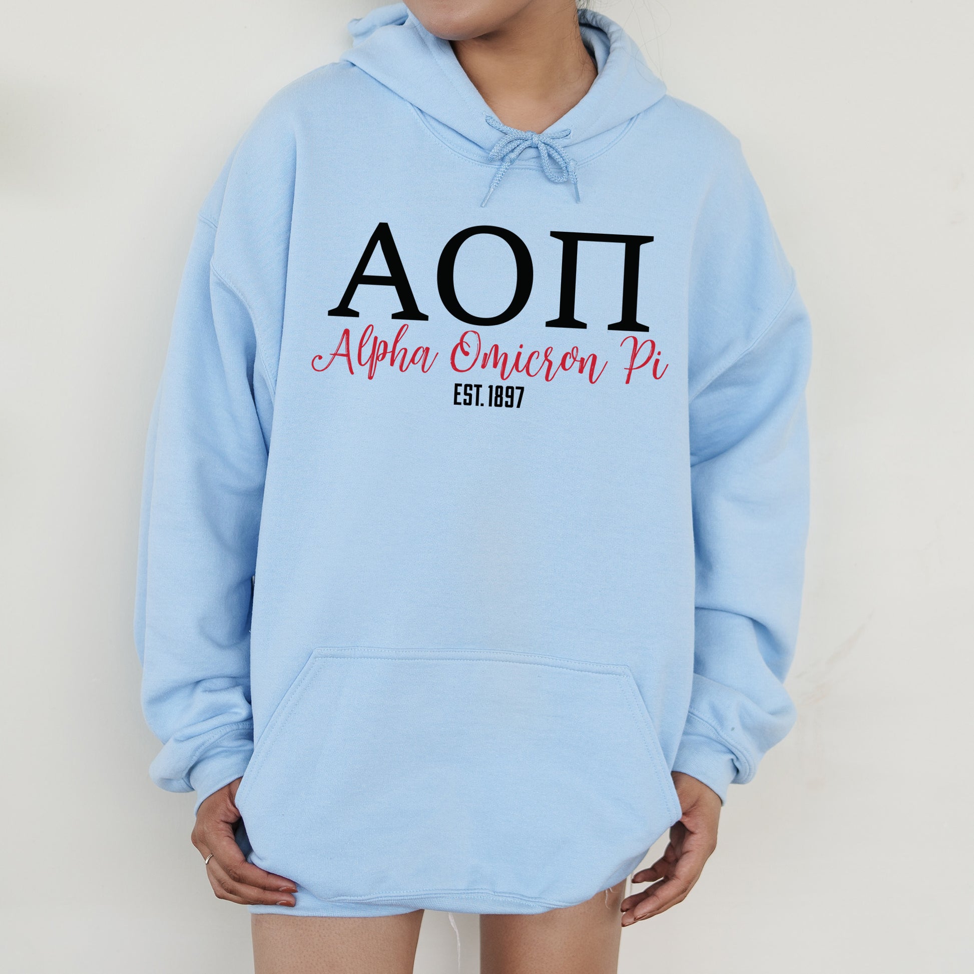 a person wearing a blue hoodie with the word aoi on it