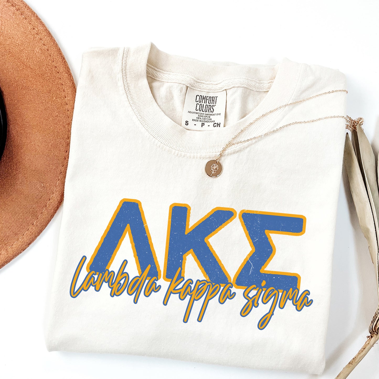 a white shirt with the letters ake on it