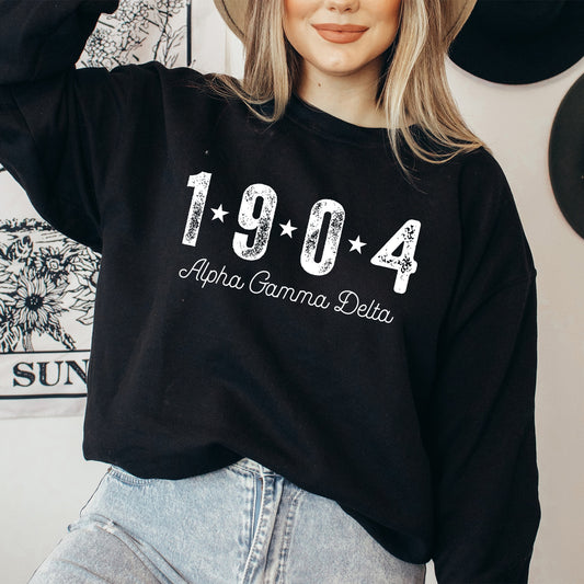 a woman wearing a black sweatshirt with the year 1994 printed on it