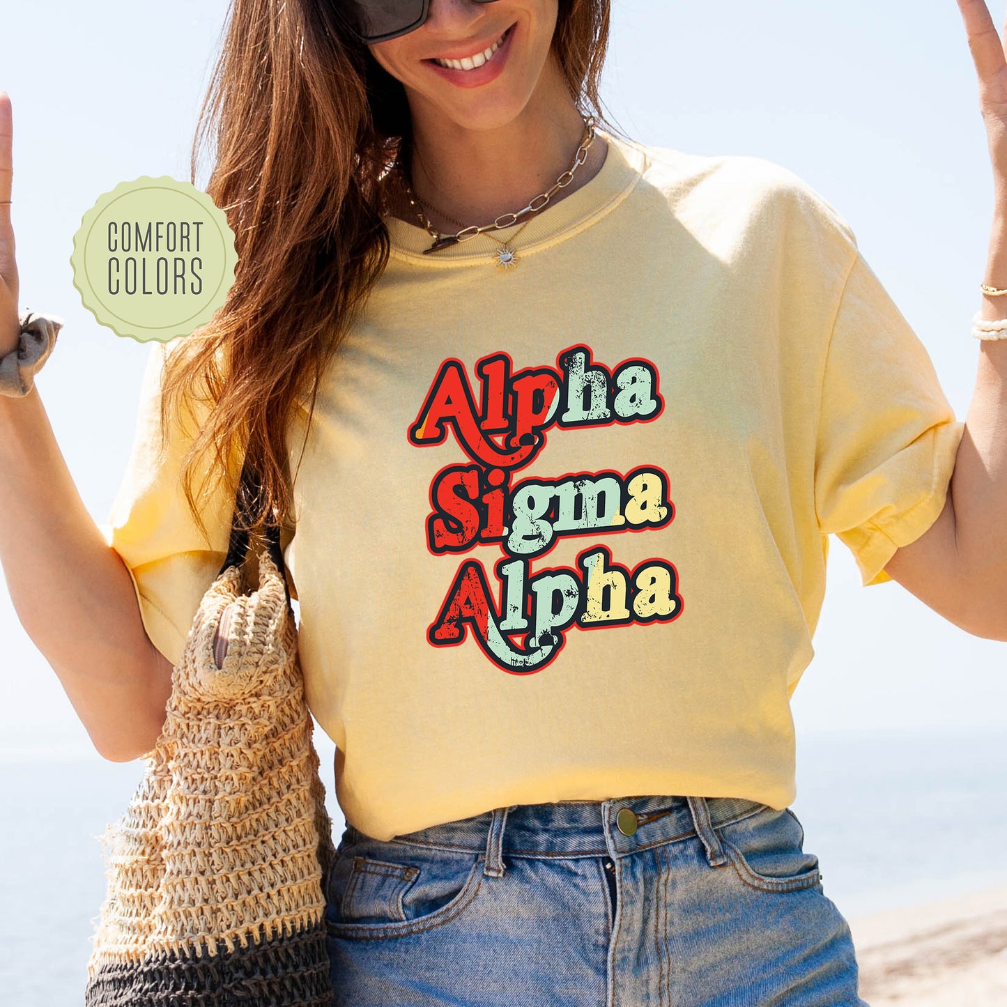 a woman wearing a yellow shirt with the word aloha on it