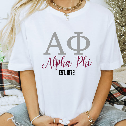 a woman wearing a white shirt with a phi phi on it