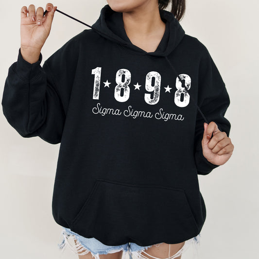 a woman wearing a black hoodie with the year 1989 printed on it