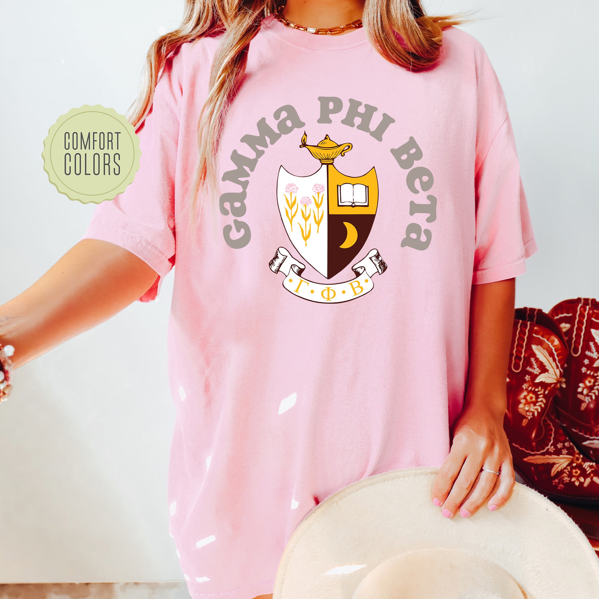 a woman wearing a pink shirt and hat