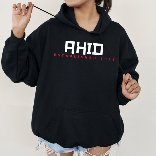 a woman wearing a black hoodie with the word ahd on it