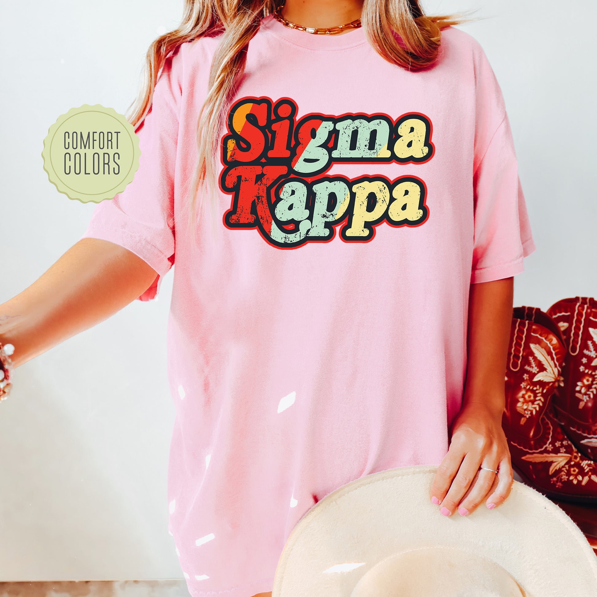 a woman wearing a pink shirt and hat