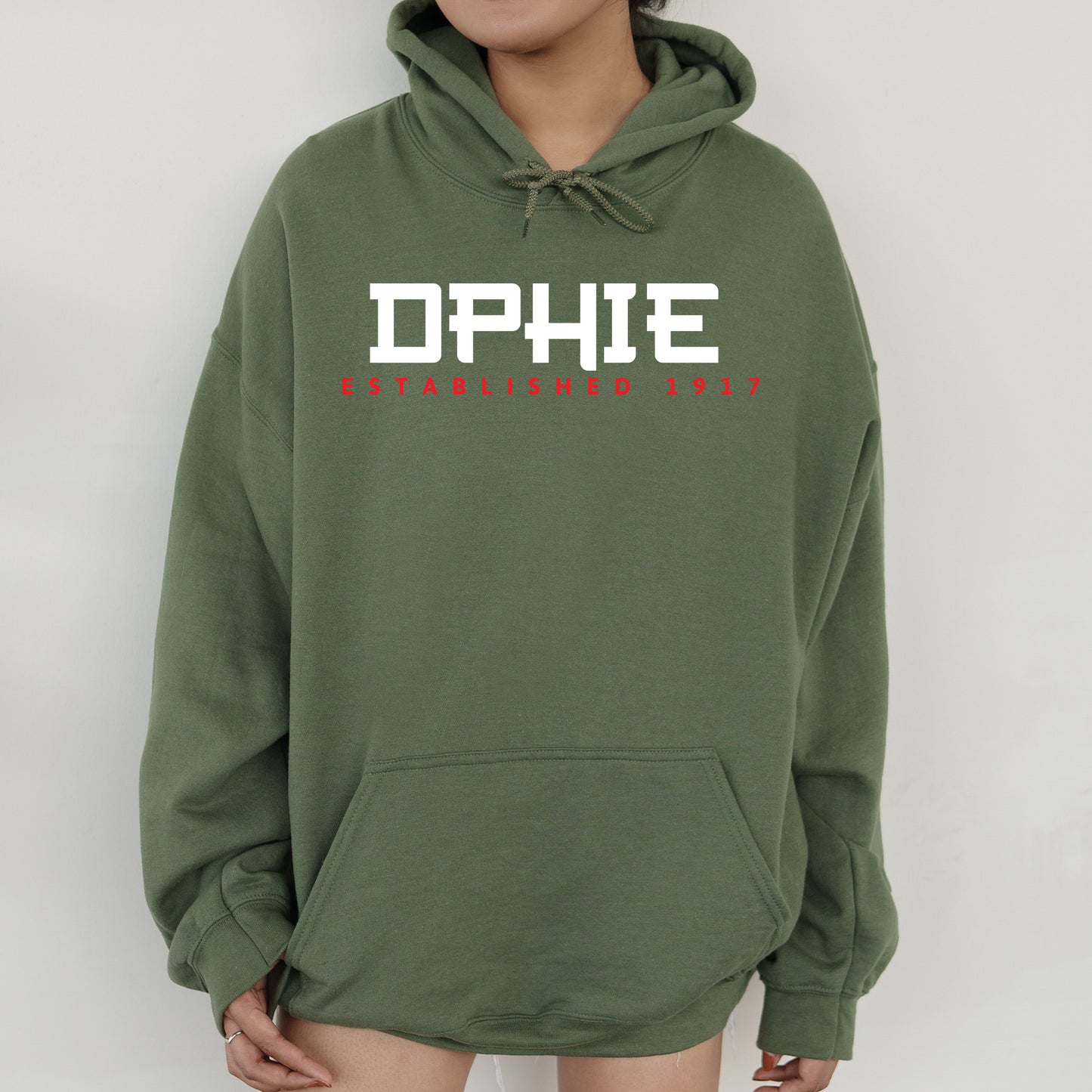 a person wearing a green hoodie with the word dphie on it
