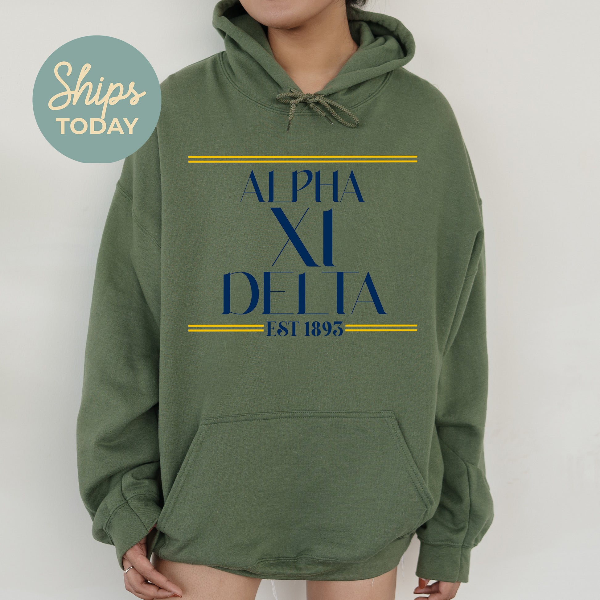 a woman wearing a green sweatshirt with the words appia di delta printed on it