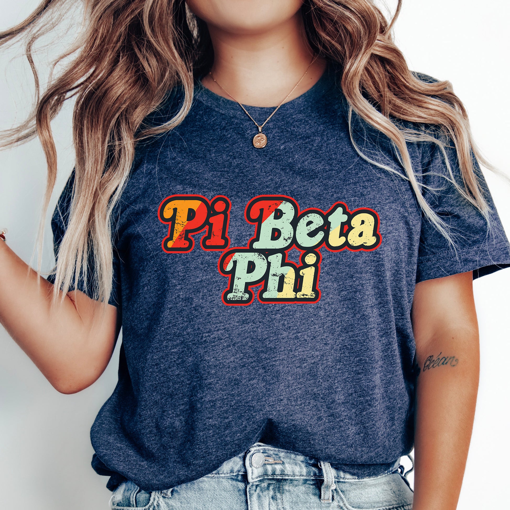 a woman with long hair wearing a shirt that says pi beta pi