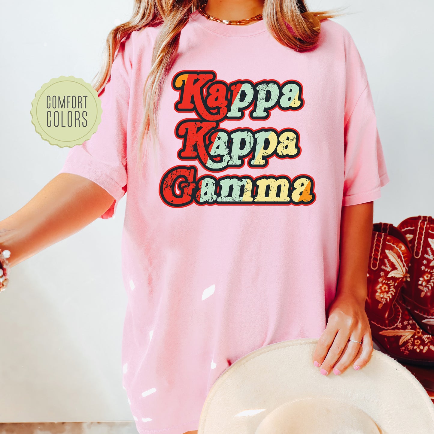 a woman wearing a pink shirt and hat