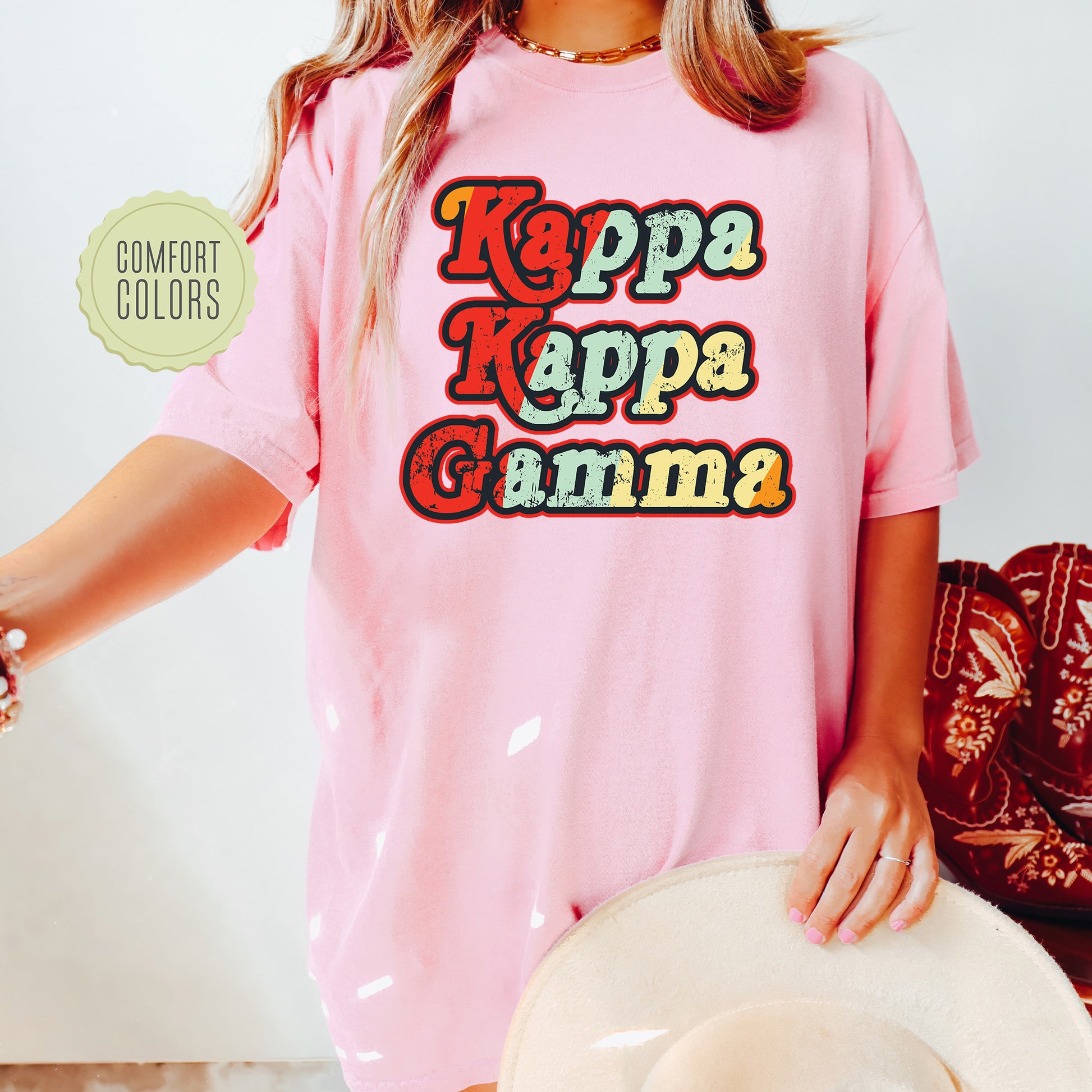 a woman wearing a pink shirt and hat