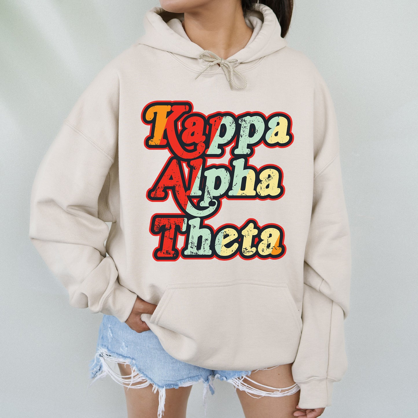 a woman wearing a white hoodie with the words kapaa apha the