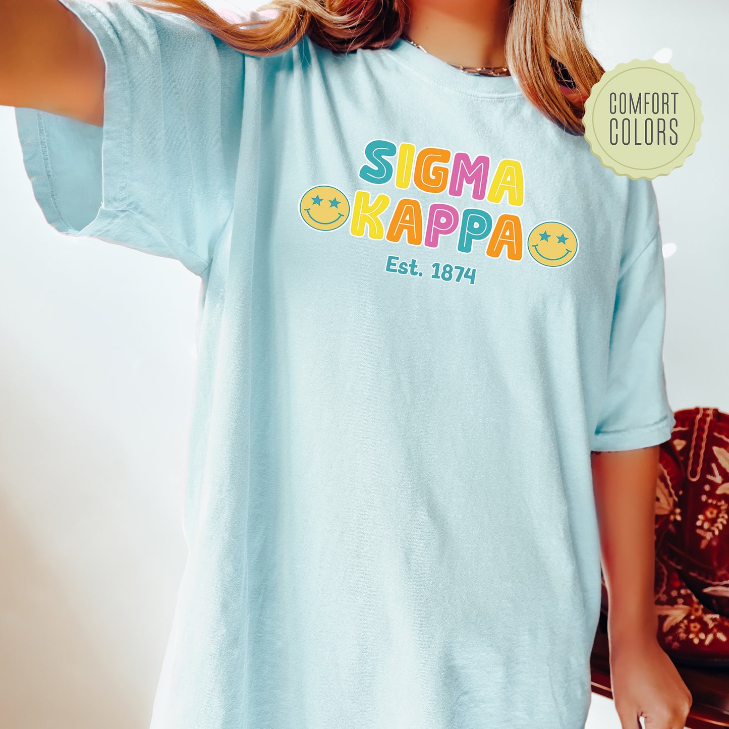 a woman wearing a t - shirt that says sigma kappa