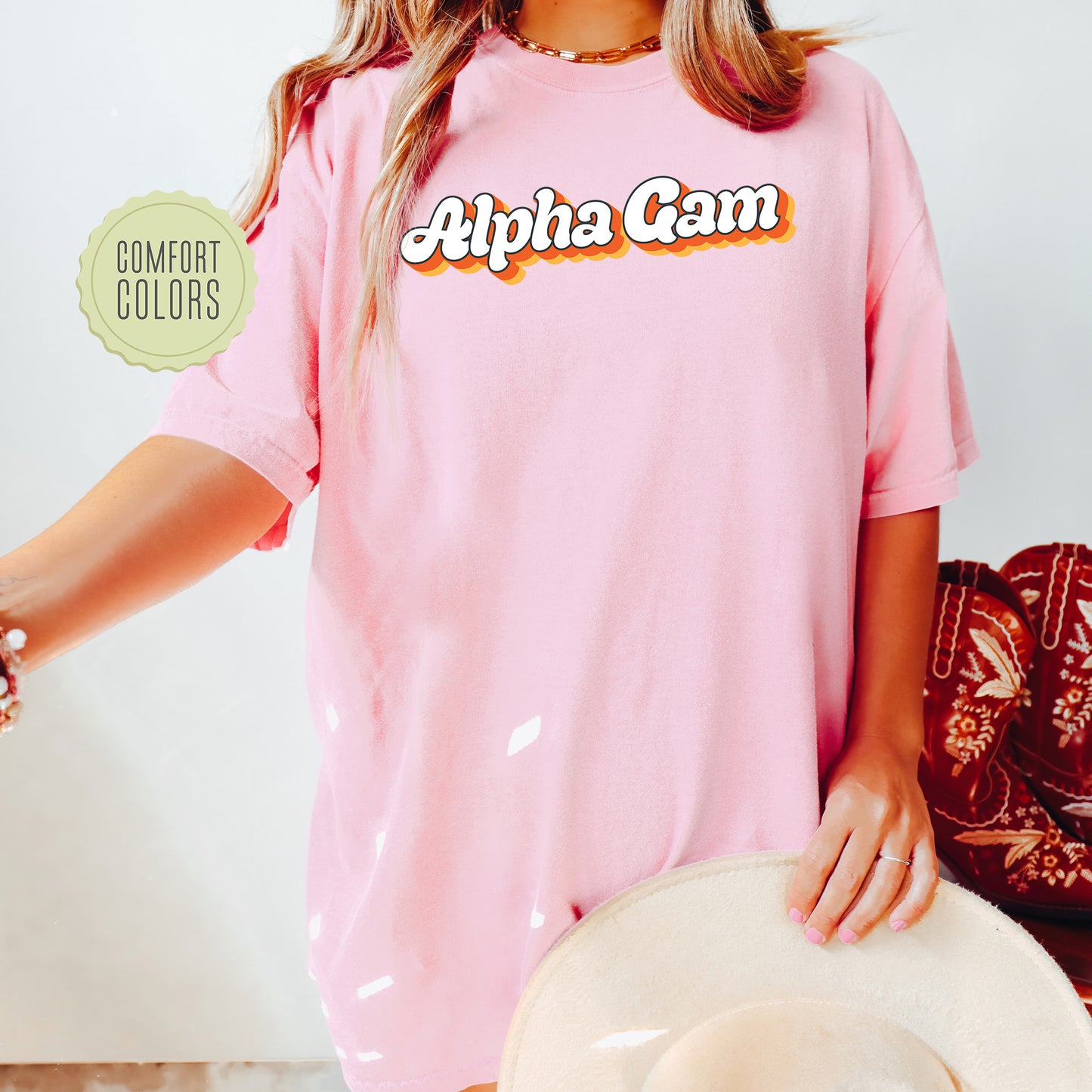 a woman wearing a pink shirt and hat