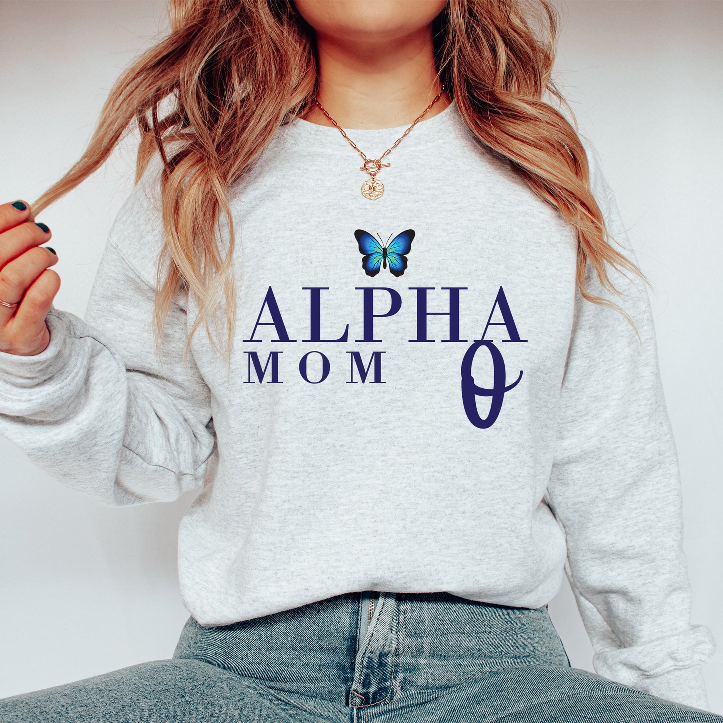 a woman wearing a sweatshirt with a butterfly on it