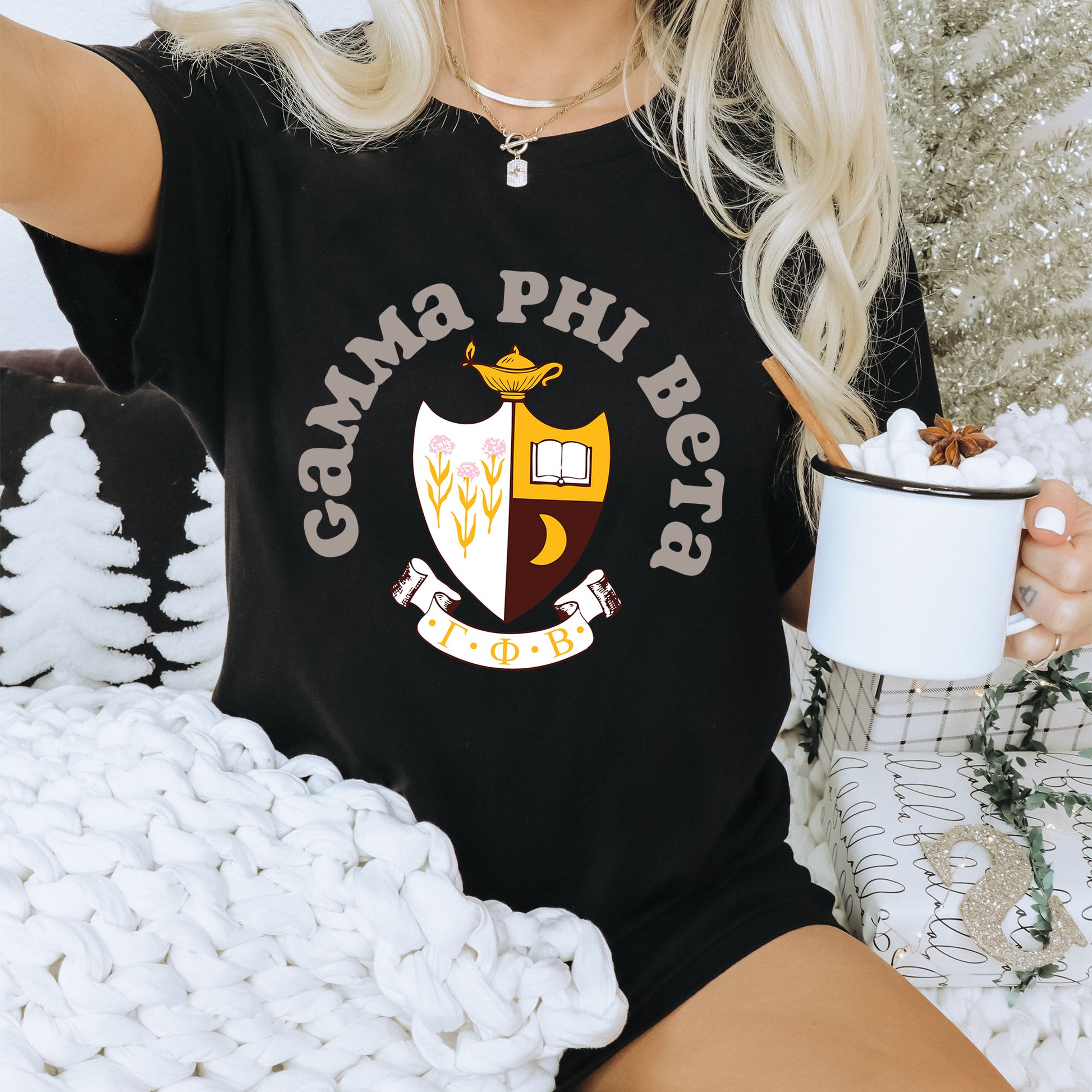 a woman sitting on a couch holding a cup of coffee